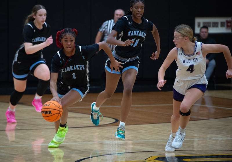 Kankakee's Ki'Asia Wilson, left, leads on a break away as Wilmington's Emilie Strong, right, follows in the title game of the Comet Classic at Reed-Custer High School on Friday, November 21, 2025.