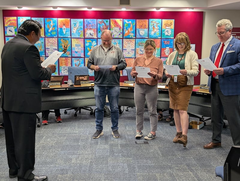 New Batavia School District 101 board members Katherine "Katy" Swiecicki and Kristin Gehrels take the oath of office. They are joined by superintendent Tom Kim, board president Craig Meadows, and board vice president Aaron Kilburg.