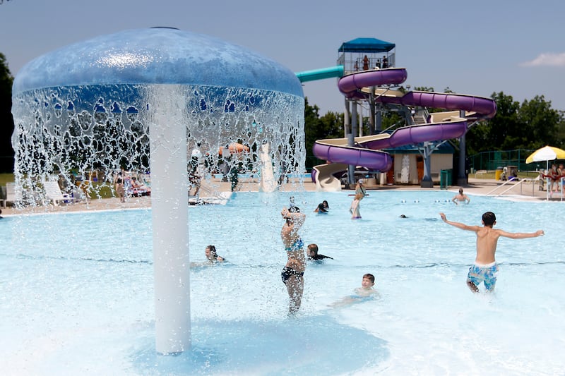 People enjoy the water while swimming on Friday, June 21, 2024, at the Woodstock Water Works.