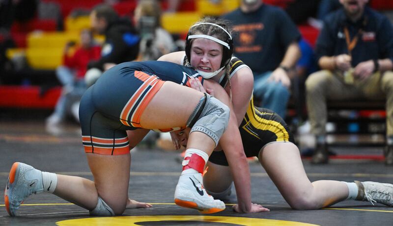 Hinsdale South’s Callie Carr, right, wrestles Oswego’s Kiyah Chavez in the 155-pound final during the Schaumburg girls wrestling sectional Saturday.