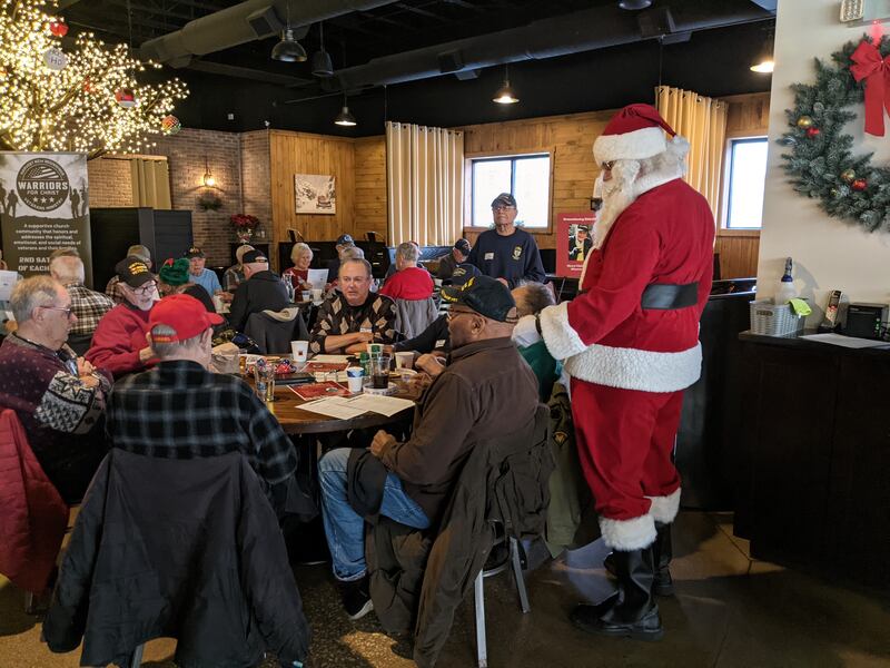 Santa Claus visits with those attending the Fox Valley Veterans Breakfast Club's holiday celebration at 113 Main restaurant in downtown Oswego on Thursday, Dec. 11, 2025.