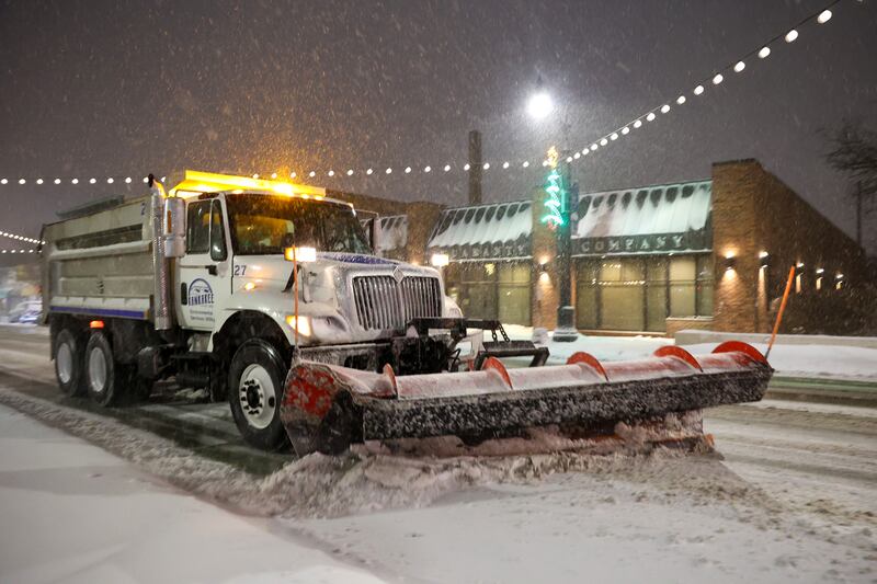 A city of Kankakee snow plow clears accumulated snow on South Schuyler Avenue on Saturday, Nov. 29, evening as flurries fell most of the day.