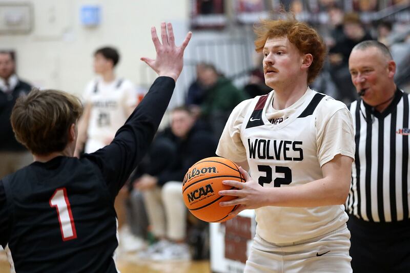 Prairie Ridge's Johnny Kemp (right) looks to pass the ball as he is guarded by Huntley's Nolan Reynolds during a Fox Valley Conference boys basketball game on Wednesday, Jan. 21, 2026, at Prairie Ridge High School in Crystal Lake.
