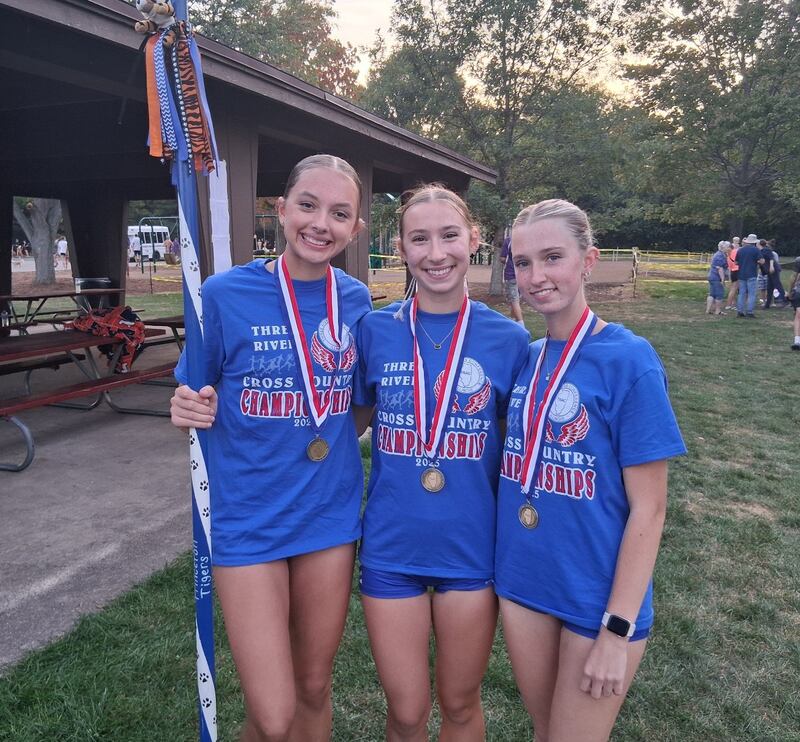 Princeton trio of Alexandra Waca (from left), Ruby Acker and Payton Frueh received all-conference honors for the second straight year in Tuesday's Three Rivers Conference cross country meet in Princeton. Acker placed third, Frueh fifth and Waca 15th.