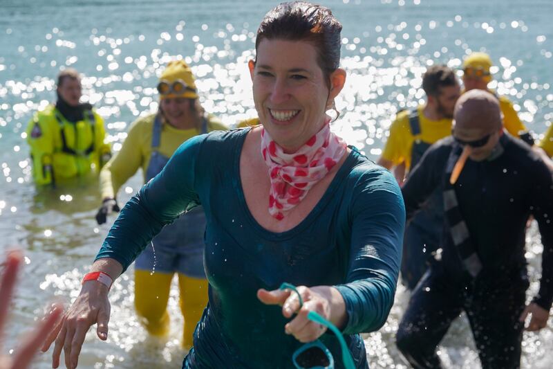 Erin Waltmire of Oswego smiles after participating in the polar plunge with a number of Kendall County Sheriffs officers during the polar plunge for special olympics at Silver Springs State Park in Yorkville on Sunday, Mar 3, 2024.