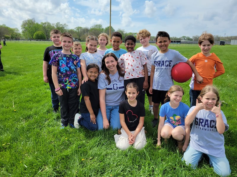 Grace Christian Academy teacher Christine Johnson gathers outside with her third grade students. Johnson took the lead with helping to organize the school's donation drop-off zone after the March 10, 2026 tornado.