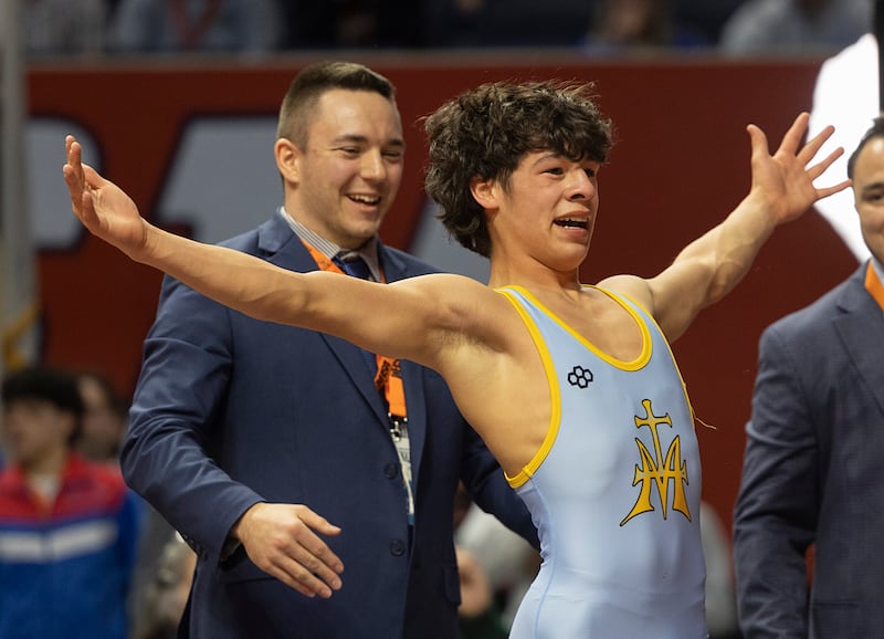 Marquette’s Wesley Janick celebrates winning the 1A 120 pound state title Saturday, Feb. 21, 2026, at the IHSA wrestling finals in Champaign.