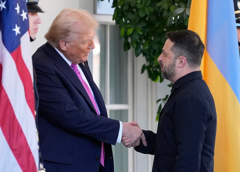 President Donald Trump, left, greets Ukraine's President Volodymyr Zelenskyy at the White House, Friday, Oct. 17, 2025, in Washington. (AP Photo/Alex Brandon)