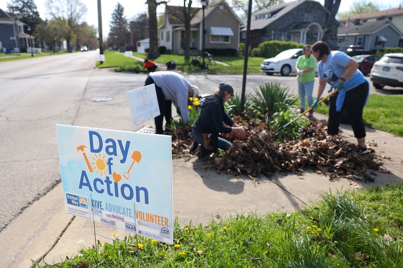 Volunteers clean up a community garden area in Kankakee's sixth ward during the United Way of Kankakee & Iroquois Counties Day of Action across the county on April 22, 2025.