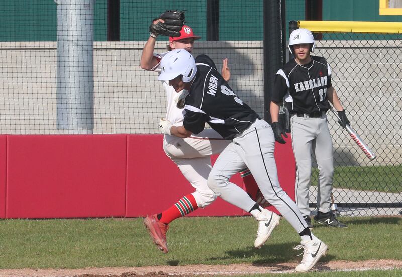 L-P's Gavin Kallis tags out Kaneland's Aidan Whildin caught in a pickle between third base and home plate on Tuesday, May 13, 2025 at Huby Sarver Field at the L-P Athletic Complex in La Salle.