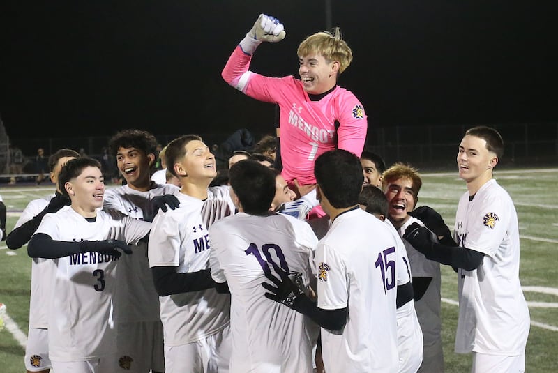 Mendota keeper Mateo Goy is carried off of the field by members of the Mendota boys soccer team after defeating Quincy Notre Dame during the Class 1A Supersectional game on Monday, Nov. 3, 2025 at Mendota High School.