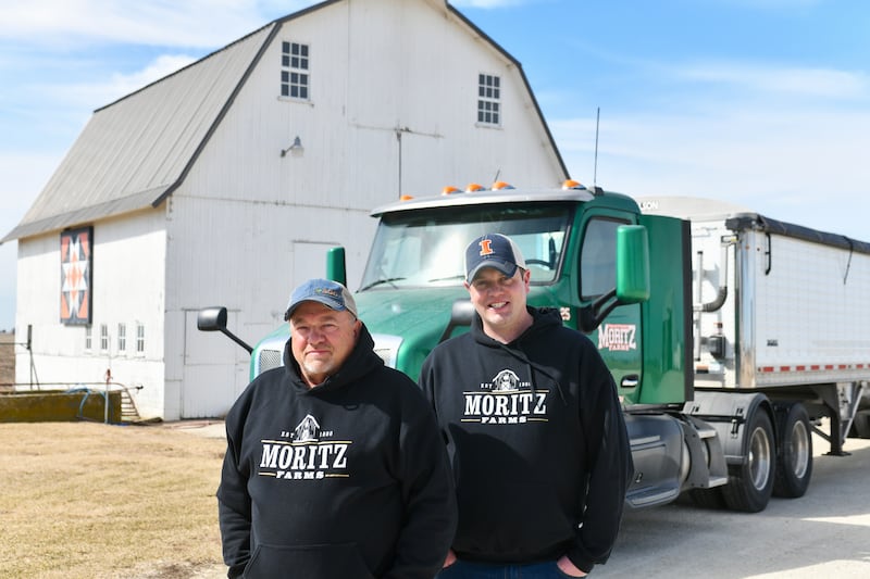 Phil Moritz, left, and his son, Brad Moritz, stand on their farm in Buckingham ahead of planting season. The father and son are the second and third generation to operate the farm after Phil's father, Walter, passed on the family business.