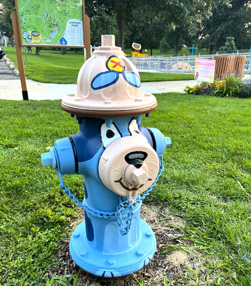 Artist Amanda Stout painted the children’s cartoon character Bluey on a fire hydrant near the Hopkins Park playground for the 2025 Paint-A-Plug program. The city of DeKalb is again soliciting applications for new painters in 2026.