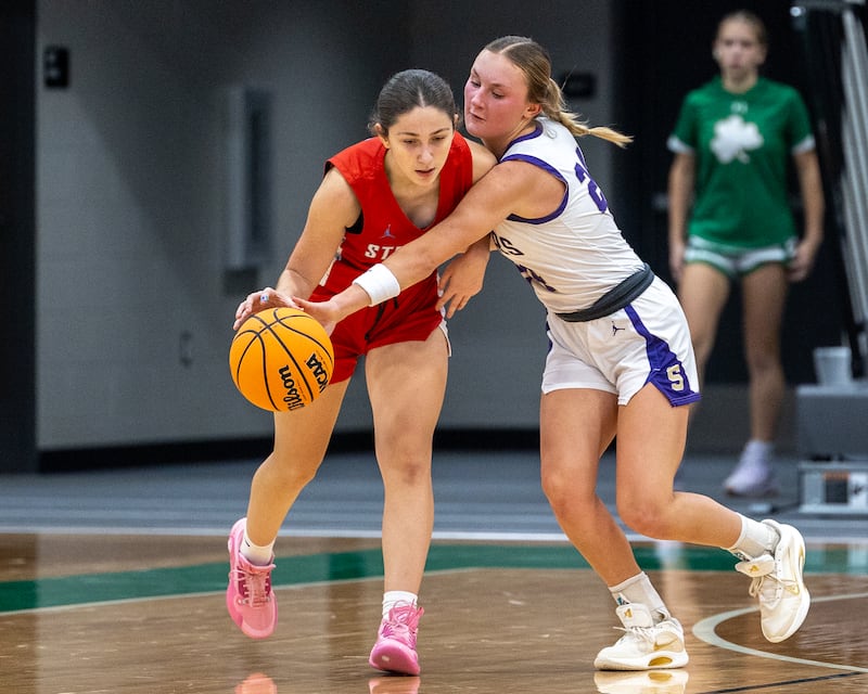 Serena's Anna Hjerpe (24) goes for a steal against Streator's Audrey Arambula on Monday, Nov. 17, 2025, during the opening game of the Seneca Pool of the Falcon-Irish Thanksgiving Tournament in Seneca.