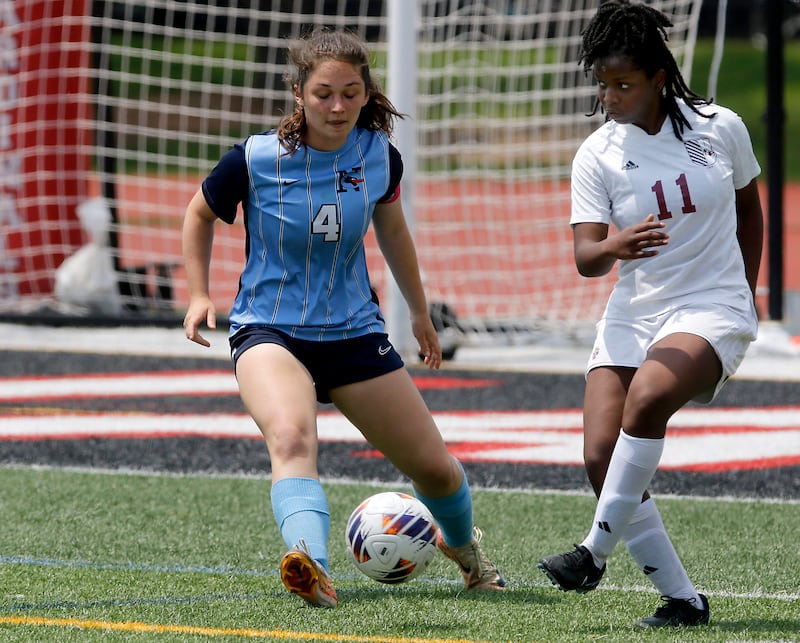 Nazareth Academy's Izzy Strnic tries to defend St. Ignatius College Prep's Kayla Washington during a IHSA Class 2A State Girls Soccer semifinal match on Friday, June 6, 2025, at North Central College in Naperville.