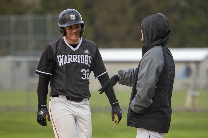 Brayden Matsko (32) of Woodland/Flanagan-Cornell talks to coach on Thursday, April 17, 2025 at Woodland High School in Streator.