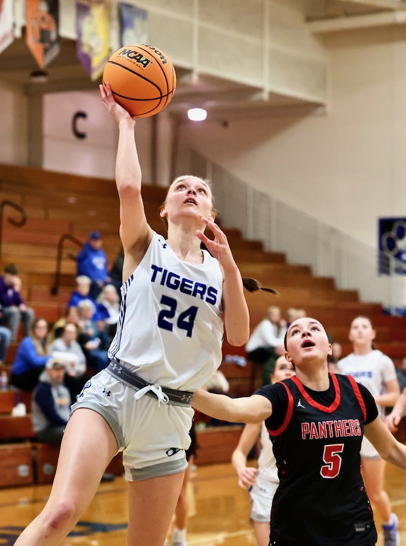 Princeton's Keighley Davis gets past E-P's Ashlyn Johnson for a first-half layup in Tuesday's game at Prouty Gym. The visiting Panthers won 51-40.