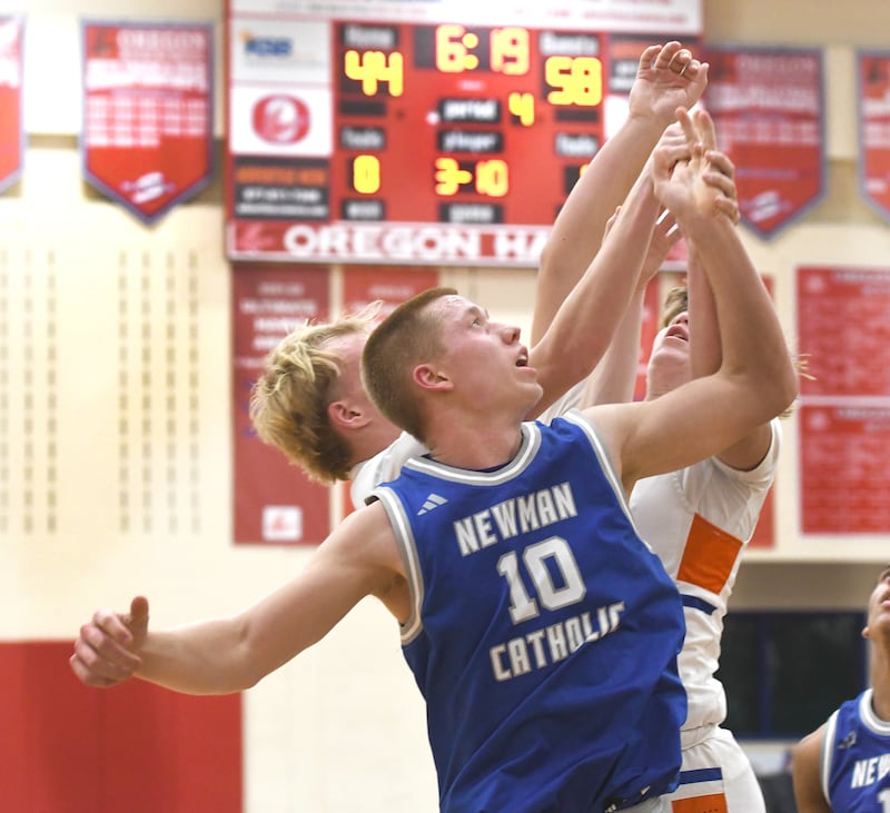 Sterling Newman's George Jungerman battles for a rebound against Genoa-Kingston at the Oregon Boys Basketball Thanksgiving Tournament on Wednesday, Nov. 26, 2025 at Oregon High School.