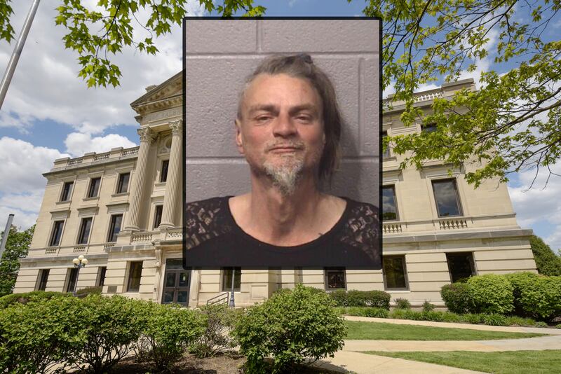 Ronny W. Reynolds was charged on Friday, Nov. 21, 2025, with threatening a public official after police said he entered DeKalb City Hall on Thursday and made verbal threats to a city official, then later threatened multiple people, including police, with a broken scissor blade, according to court records. (Inset photo provided by DeKalb County Jail)