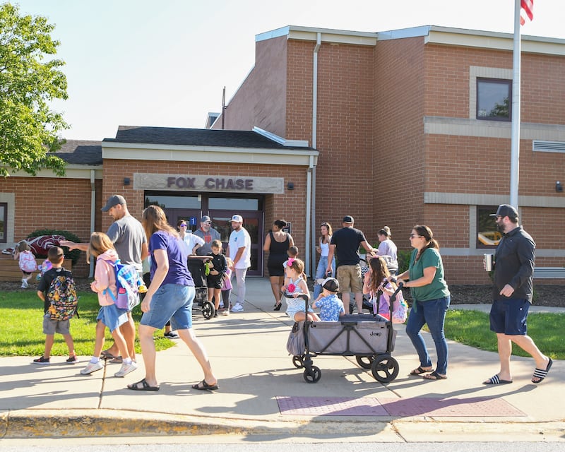 Students get dropped off at Fox Chase elementary school in Oswego during the first day of the school year on Wednesday Aug. 16, 2023.