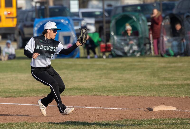 Rock Falls’ Alex Espinoza touches first for the second out in a triple play against Princeton Thursday, March 27, 2025.