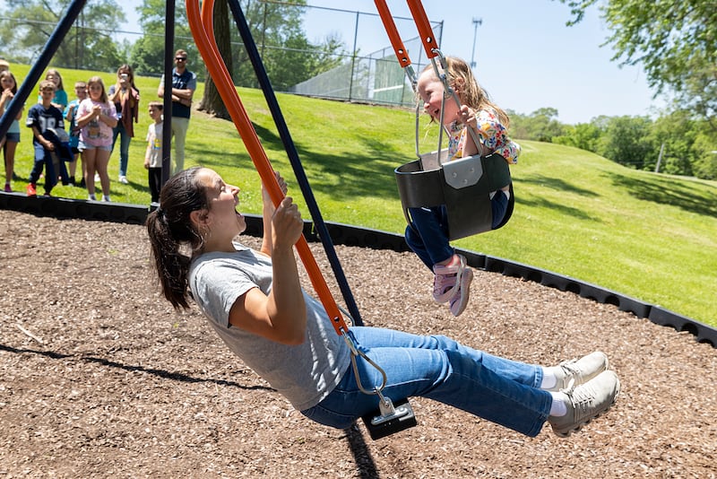 Mom Nicole Theobald and Sophia take the first ride on the newly dedicated Sophia’s Swing Friday, May 15, 2026, at EC Smith Park in Dixon. The Expression Swing promotes intergenerational play and inclusion.