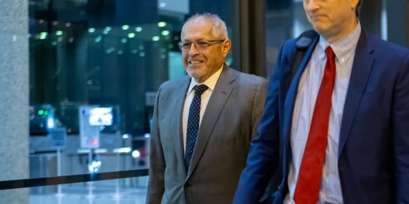 Fidel Marquez, a former Commonwealth Edison executive-turned-cooperating witness, leaves the Dirksen Federal Courthouse with his attorney on Tuesday, Nov. 12, 2024, after his fifth day of testimony in the bribery and racketeering trial of former Illinois House Speaker Michael Madigan.