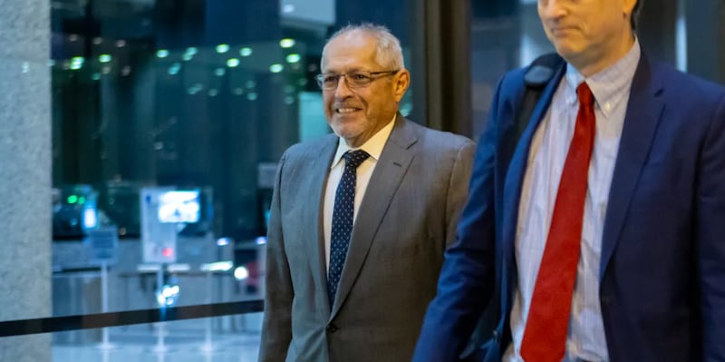 Fidel Marquez, a former Commonwealth Edison executive-turned-cooperating witness, leaves the Dirksen Federal Courthouse with his attorney on Tuesday, Nov. 12, 2024, after his fifth day of testimony in the bribery and racketeering trial of former Illinois House Speaker Michael Madigan.