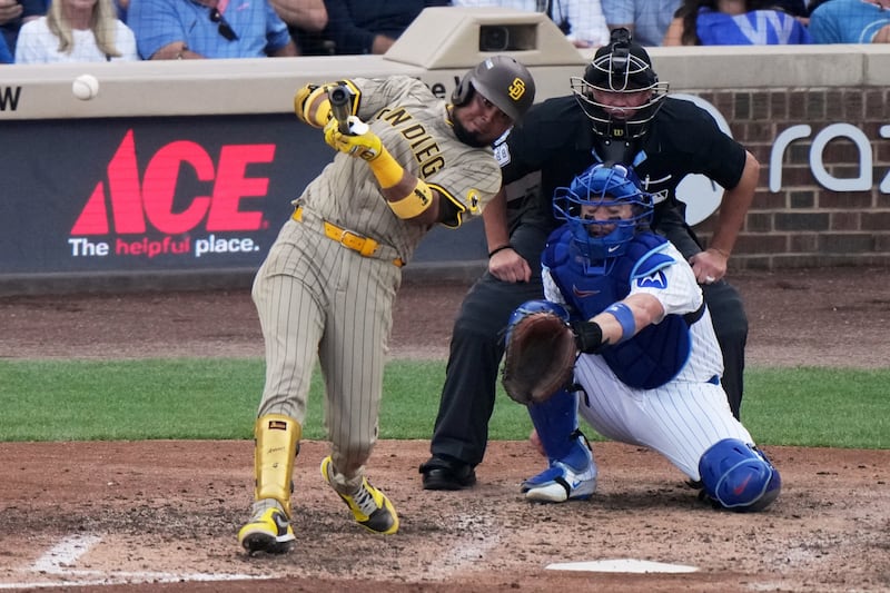 San Diego Padres' Luis Arraez hits a single during the seventh inning of Game 2 of a National League wild card baseball game against the Chicago Cubs Wednesday, Oct. 1, 2025, in Chicago. (AP Photo/Nam Huh)