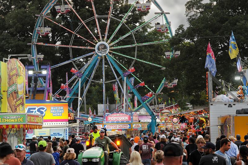 The Sandwich Fair midway is packed with patrons on Thursday, Sept. 5, 2024, at the fairgrounds in Sandwich.