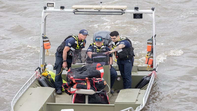 Photos: Search crews work to locate an individual who went into the Rock River