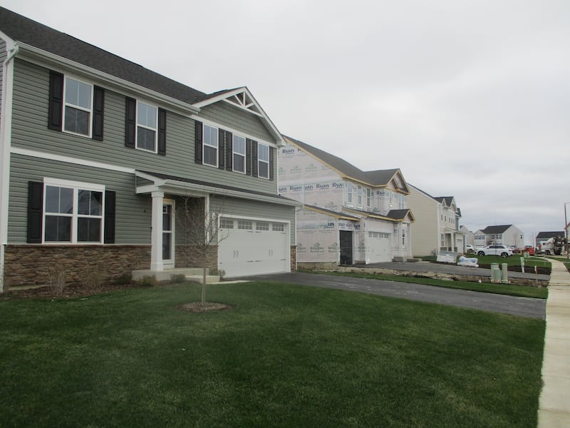 A row of newly built homes and houses under construction seen at the Deer Crossing subdivision in Joliet. Nov. 22, 2024