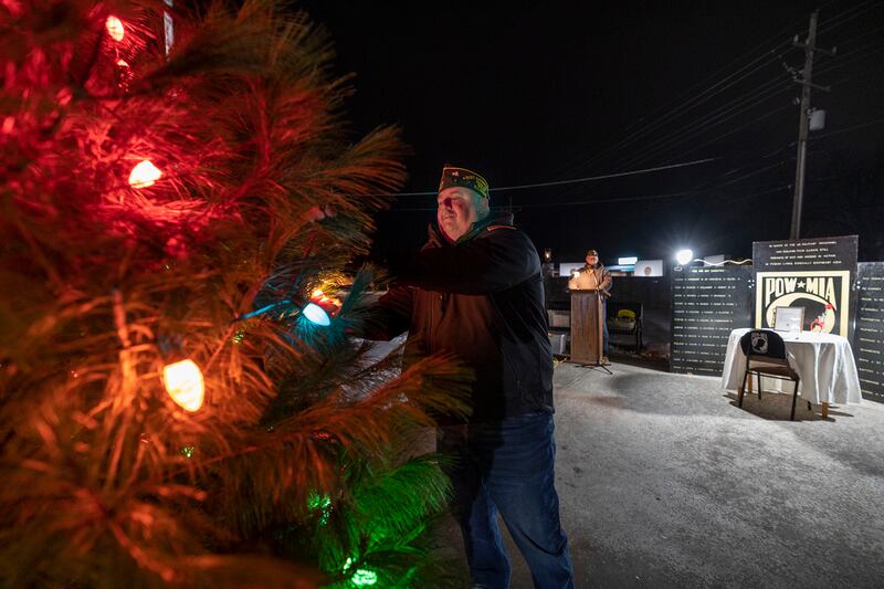 VFW Post 540 commander Tony Kulavik lights up the bulbs Saturday, Dec. 6, 2025, during a POW/MIA tree lighting at Veterans Memorial Park in Dixon.