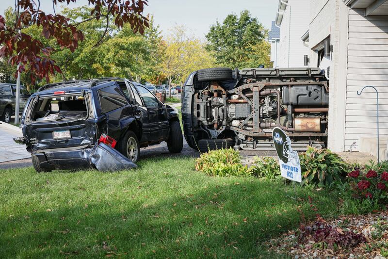 No injuries were reported Friday in a crash that occurred in the driveway of a Wonder Lake home that flipped the car parked there into the garage.
