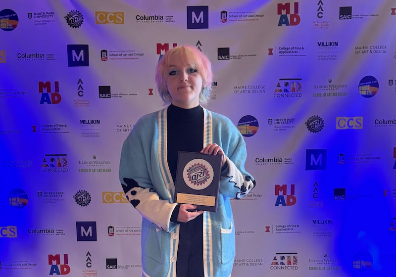 Central High School senior Hazel Anders, 17, of Hampshire, displays her plaque for Outstanding Achievement in Portfolio Quality/Top Scholarship Recipient at this year's Illinois High School Art Exhibition. Five institutions offered her $372,000 in scholarships based on her art submissions.