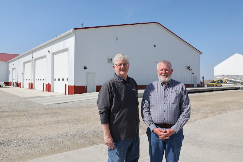 Jeff LaFollet, right, Heritage FS St. George site manager, and J.D. Marquis, the site's Precision Farming Specialist, stand on the grounds of the recently expanded location.