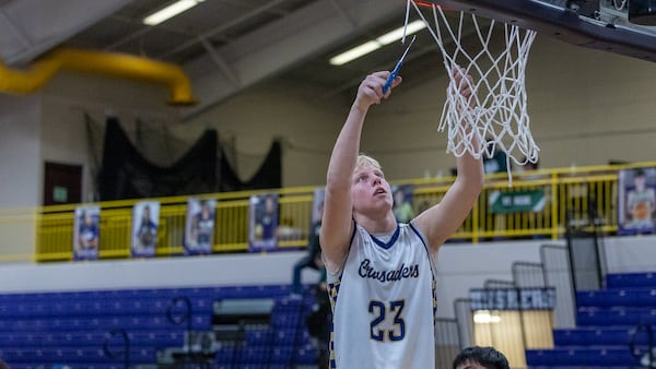 Photos: Marquette boys basketball clinches Regional title against St. Bede