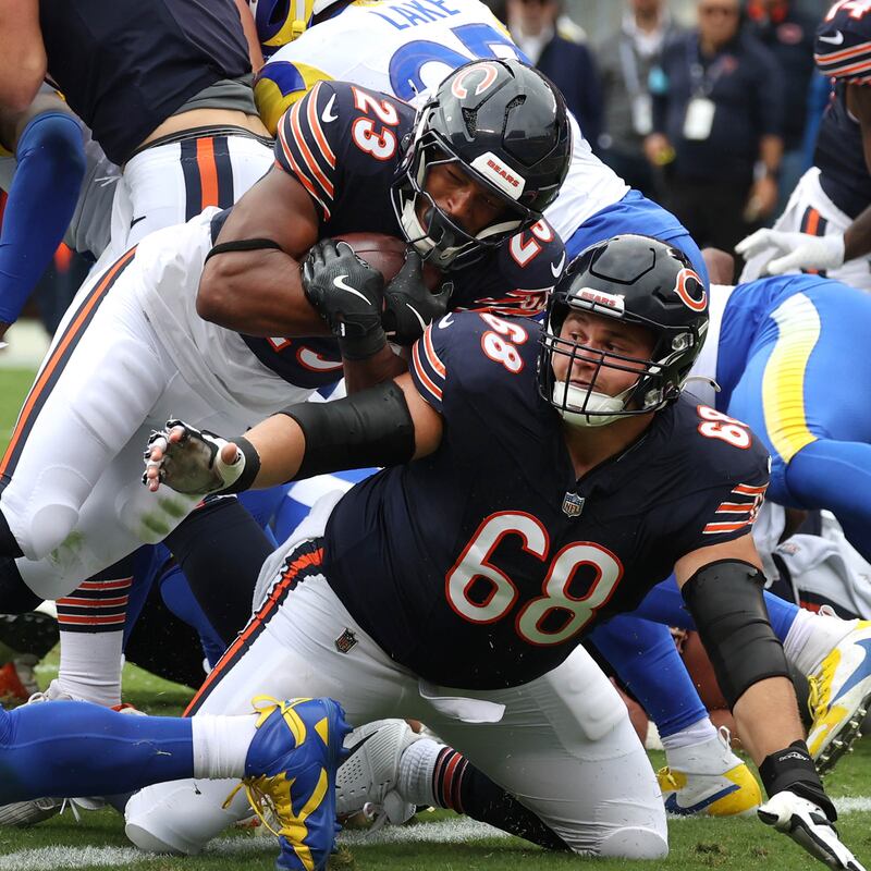 Chicago Bears running back Roschon Johnson follows the block of Chicago Bears center Doug Kramer Jr. into the end zone for a touchdown during their game against the Los Angeles Rams Sunday, Sept. 29, 2024, at Soldier Field in Chicago.