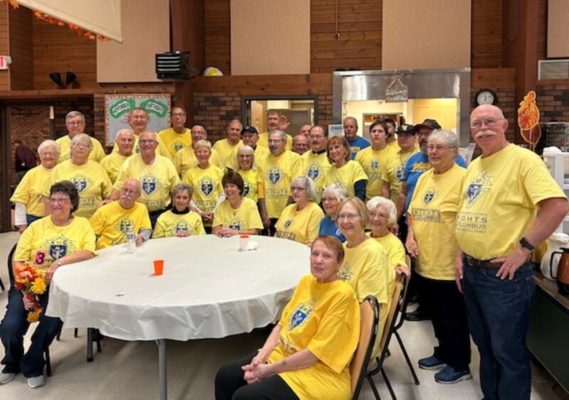 Volunteers with the Knights of Columbus, the Lady Knights Auxiliary, and Senior Services Associates prepare turkey meals for around 150 seniors at the Beecher Center in Yorkville on Nov. 18, 2025.