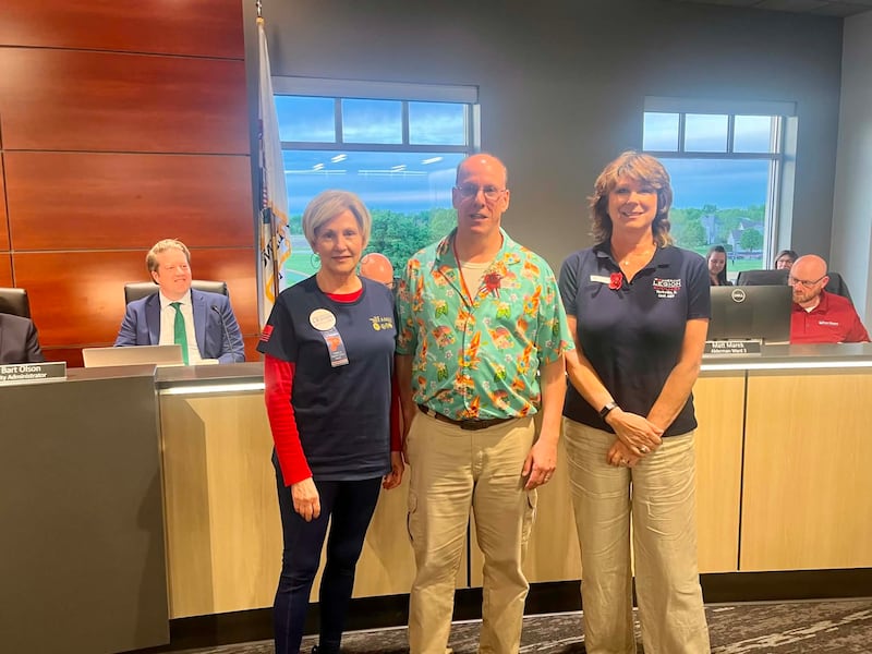 Yorkville Mayor John Purcell displays the memorial 'red poppy' to honor veterans fallen in war. Purcell declared Poppy Awareness Days with members of the Yorkville American Legion and Auxiliary Posts.