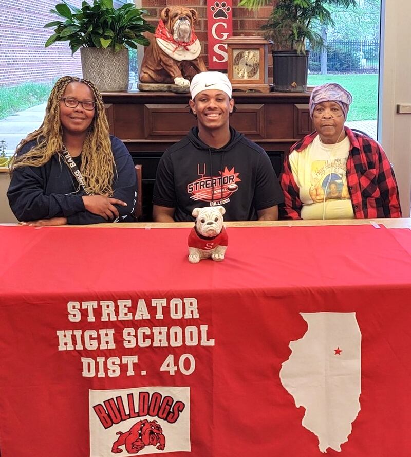 Recent Streator graduate and Times All-Area Football first-teamer Tristan Finley – pictured here at his signing ceremony bookended by his mother, Britney Finley, and grandmother Ernestine Philips – has committed to continue his education at Benedictine University in Lisle and his football career at the NCAA Division III level with the Eagles.