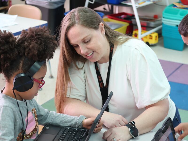 Gwendolyn Brooks Elementary kindergarten teacher Sarah Schneider works with one of her students during the 2025-2025 school year.