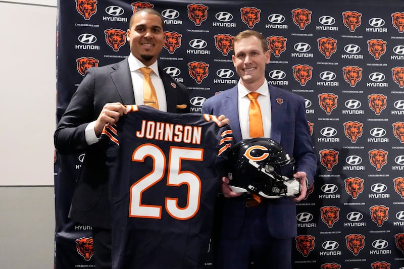 Chicago Bears general manager Ryan Poles, left, and new head coach Ben Johnson pose during an NFL football news conference at Halas Hall in Lake Forest, Ill., Wednesday, Jan. 22, 2025. (AP Photo/Nam Y. Huh)
