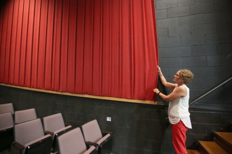 See the red fabric inside Stage 212? It will be replaced with acoustic panels that will improve sound quality. Natalie Smigel, business manager for Stage 212 and fundraising chairman, shows some of the changes planned during a walk-through Wednesday, June 12, 2024, at the La Salle. The theater is looking to complete renovations in the fall of 2025.