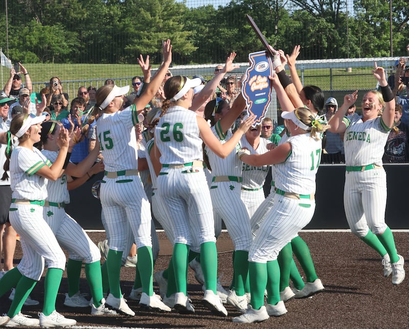 Members of the Seneca softball team hoist the Class 2A Supersectional plaque after defeating Brimfield 3-0 on Monday, June 1, 2026 at the Eastside Centre in East Peoria.