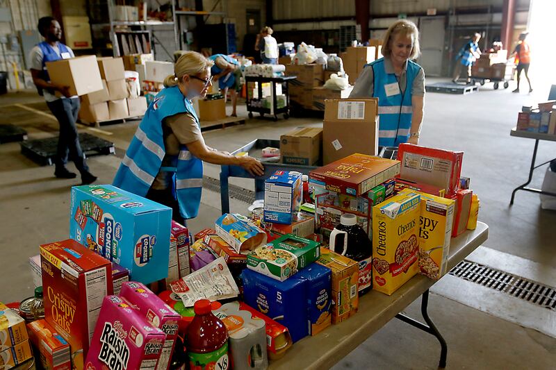 Arlene Ryndak and Sue Reinhardt, both volunteers from the McHenry County Medical Reserve Corp sort items during the Operation Dropbox Exercise on Tuesday , June 11, 2024, at the McHenry County Division of Transportation near Woodstock. The training exercise simulates the process of unloading and distributing medical counter-measures during emergencies along with helping to sort and distribute the donated items to veterans and their families in the county.