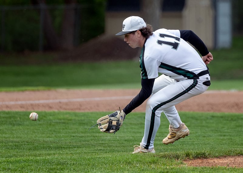 Rock Falls’ Carter Hunter comes off the mound to make a play against North Boone Tuesday, April 28, 2026. Hunter came in to pitch in relief of Ethan Moeller.