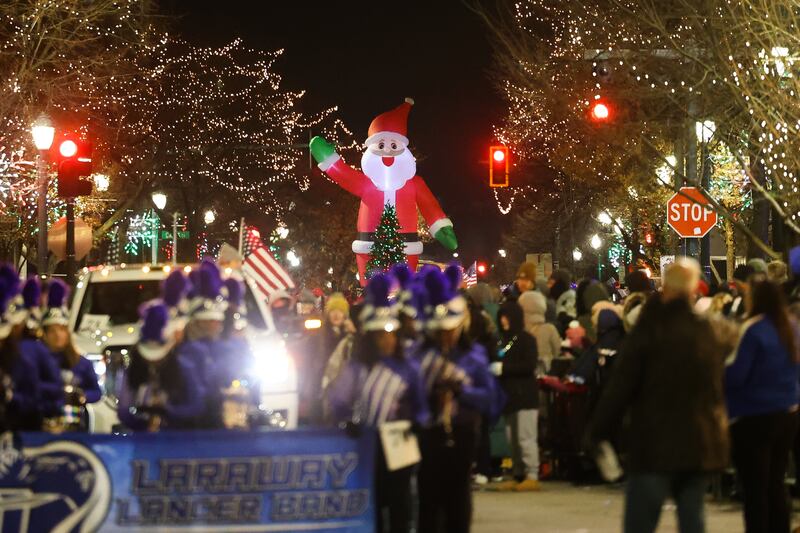 Santa rides down Chicago Street at the Joliet Light up the Holidays Parade in downtown Joliet on Friday, Nov. 24, 2023.