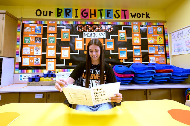 Britney Pitzer, third grade teacher at Jefferson in Dixon, reads the champion book “The Book With No Pictures.”