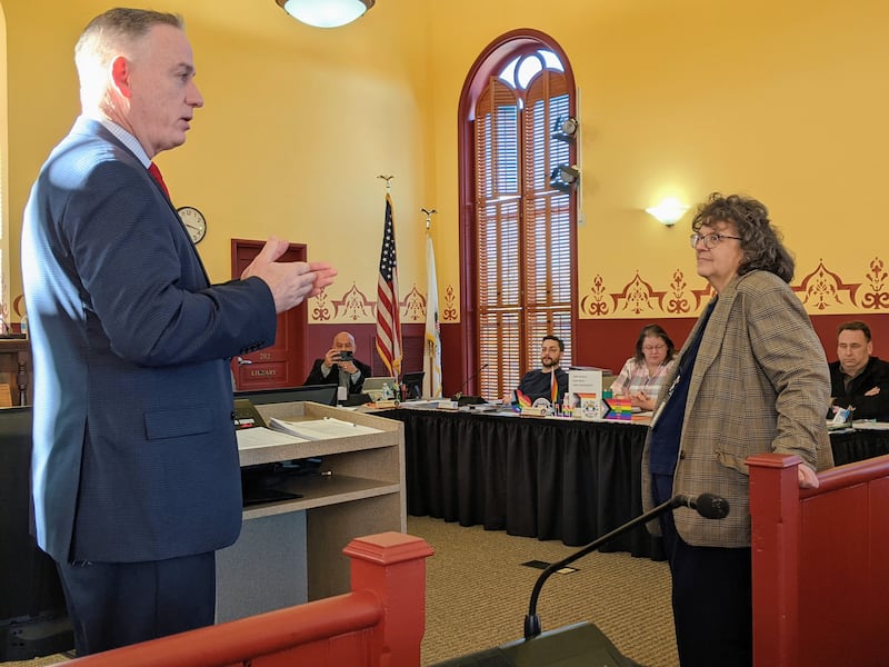 Kendall County Judge John McAdams, left, spoke about the work of Kendall County First Assistant State's Attorney Brenda Karales, right, during the Jan. 20 Kendall County Board meeting.